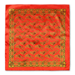 Red satin bandana with gold and black paisley print and floral border.