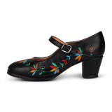 Black leather Mary Jane folklórico dance shoe with multicolor floral embroidery and a mid-height block heel.