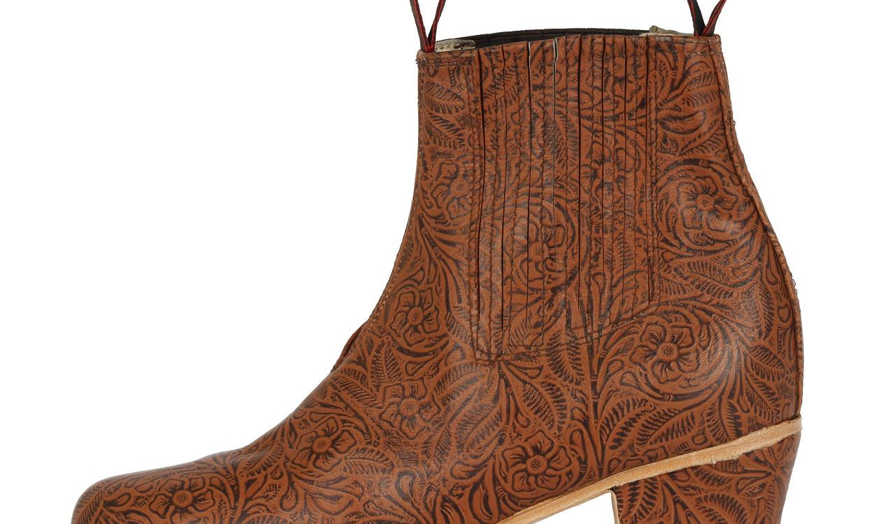 Men's brown leather ankle boot with embossed floral tooling and stacked block heel.